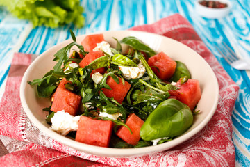 salad with watermelon, feta cheese and arugula
