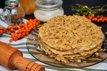 honey cake, sea buckthorn and kitchen utensils