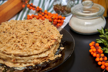 honey cake, sea buckthorn and kitchen utensils