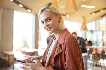 Beautiful woman waiting for her man in the cafe
