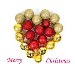 Red yellow Christmas tree balls in the shape of a heart with the inscription Merry Christmas isolated on a white background. Toys, New year, decorations.