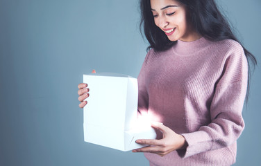 woman hand holding white box