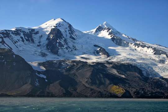 Beerenberg volcano on a foggy morning on Jan Mayen volcanic island.