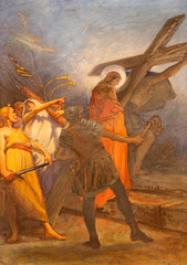 COMO, ITALY - MAY 8, 2015: The painting -  Simon of Cyrene helps Jesus carry the cross in church Santuario del Santissimo Crocifisso as the part of Via Crucis by Pnziano Loverini (1917).