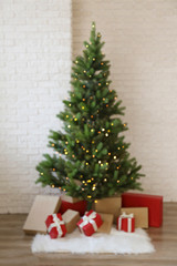 Traditional christmas pine tree with holiday decorations, copy space for text. Decorative lights glowing on fir. Close up, background, interior.