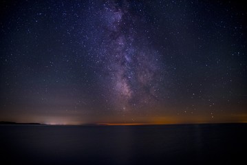 Beautiful shot of the dark purple sky filled with stars at the night