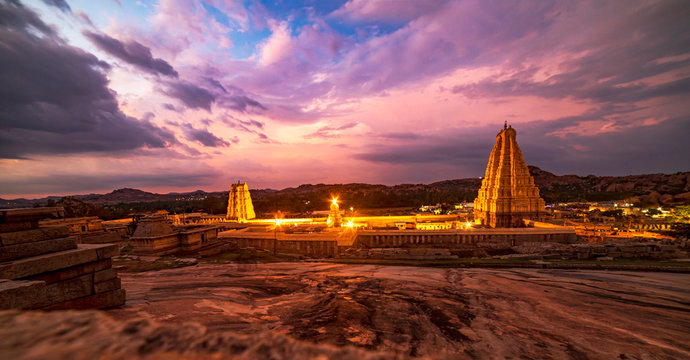 sunset over the temple in old city hampi