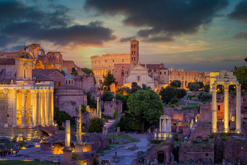 Fototapeta na wymiar Forum Romanum and Colosseum in Rome with dramatic colorful sky