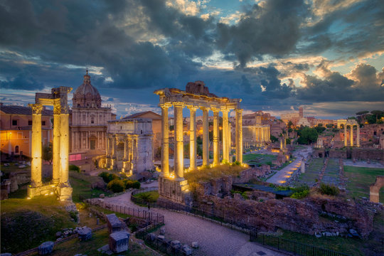 Forum Romanum archeological site in Rome with dramatic colorufl sky