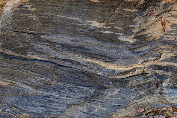 Textura natural da superfície da rocha, onde se pode ver as linhas desenhadas no longo do tempo....