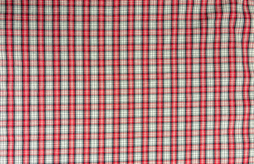 Fabric with a red checkered pattern as a texture.