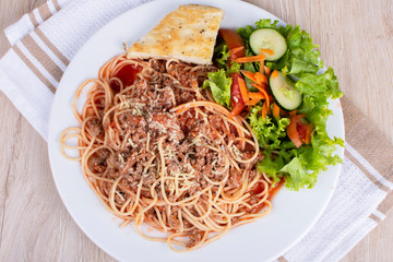 Spaghetti with Bolognese sauce, bread and salad