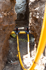 Main gas pipe and two connections with signal cables connected using fittings for electrofusion...