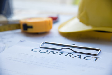 Contract of Construction Architech project signing on construction site. Architect design on planning project with yellow helmet man, stationery set 