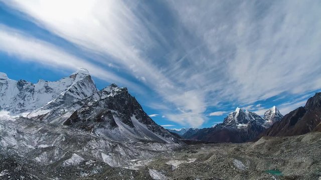 Ama Dablam, Cholatse and Taboche Mountains at Sunny Day. Blue Sky with Clouds. Himalaya, Nepal. Time Lapse