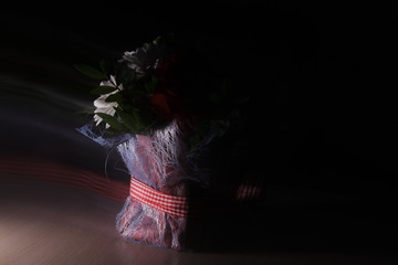 Vibes, the spirit of a bouquet, aroma, soaring over multi-colored bright flowers. A bouquet shot...