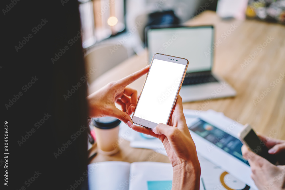 Poster cropped view of hands holding smartphone gadget with advertising area for your internet website or c