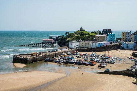 High angle view of buildings, sandy beach and harbor of Tenby