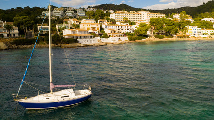 Fototapeta na wymiar Alcudia coastline with yacht mallorca spain