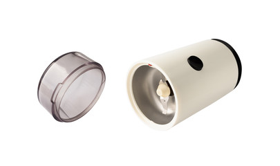 Open flying coffee grinder with cap isolated on white background