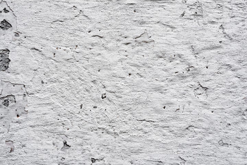 Texture of a concrete wall with cracks and scratches which can be used as a background