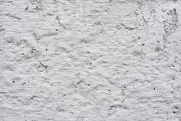 Fototapeta premium Texture of a concrete wall with cracks and scratches which can be used as a background