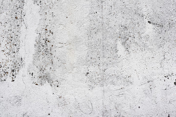 Texture of a concrete wall with cracks and scratches which can be used as a background