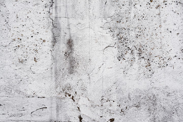 Texture of a concrete wall with cracks and scratches which can be used as a background