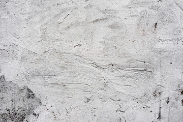 Texture of a concrete wall with cracks and scratches which can be used as a background