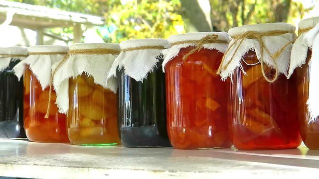 glass jars with home preservation. Fruits, vegetables, jam, compote. Stocks for the winter. Natural garden food for the family