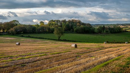 Fototapeta na wymiar Sunset country village scenic view landscape farming straw bales Cork Ireland
