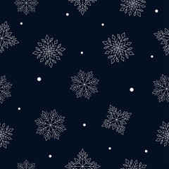 Fototapeta na wymiar White snowflakes with little shapes on dark blue background. Seamless winter pattern.