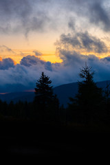 sunset mountain sky blue colorful autumn sun light yellow orange clouds tree smoke fog haze
