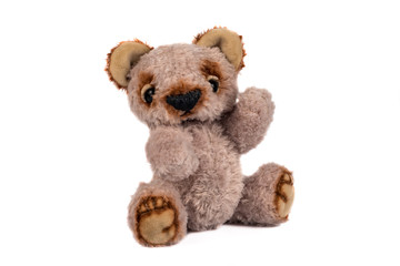 Vintage toy plush teddy bear isolated on white background