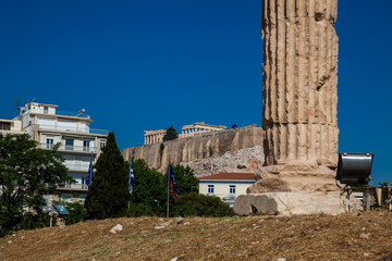Ruins of the Temple of Olympian Zeus also known as the Olympieion and the Acropolis at the center of the Athens city in Greece