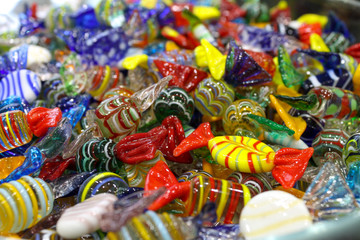 Fototapeta na wymiar Closeup to venetian Murano colorful glass candies in Venice Italy