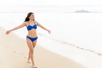 Fototapeta premium Woman Feels It Better On The Beach