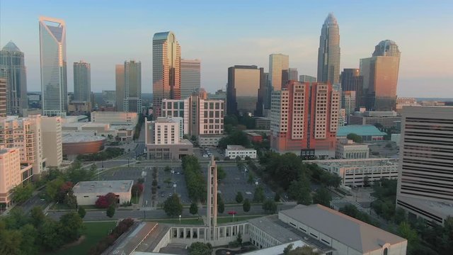 Aerial: downtown Charlotte buildings at sunset. Charlotte, North Carolina, USA. 10 August 2019
