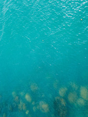 Stony bottom under greenish transparent water. Thailand	