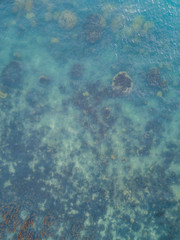 Stony bottom under greenish transparent water. Thailand	