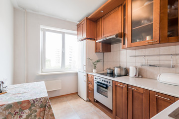 Russia, Moscow- July 06, 2019: interior room apartment. standard repair decoration in hostel. modern kitchen, dining area