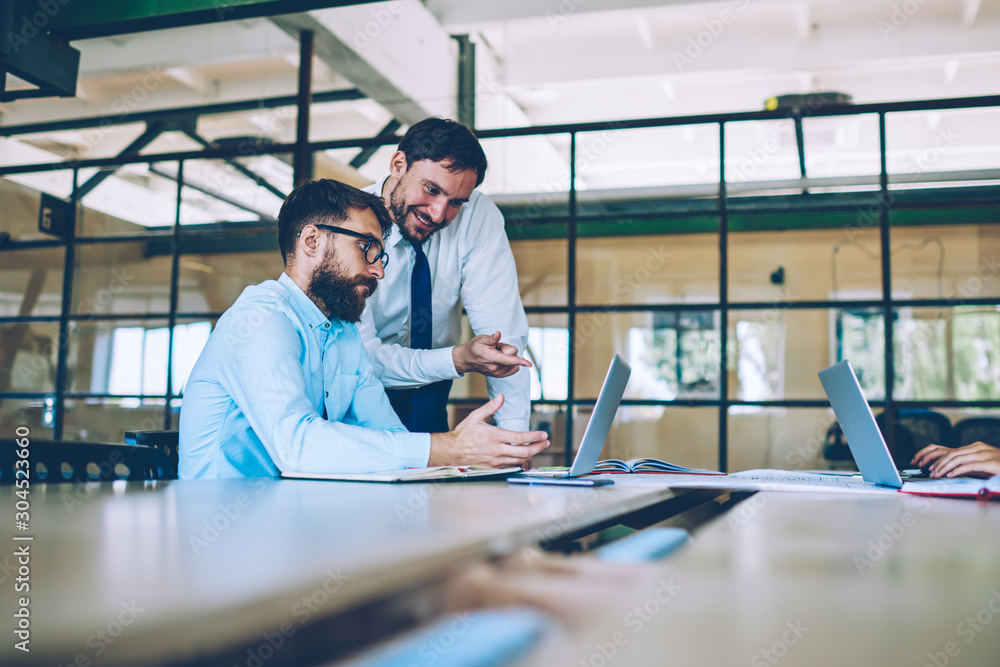 Aufkleber professional men discussing ideas of productive strategy for company during searching information on