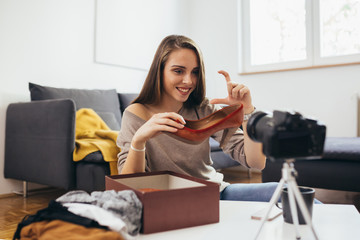oman influencer vlogging about womans fashion shoes