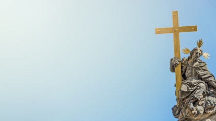 Banner with Column of the Holy Trinity and Figures of Saints holding the cross in Prague, Czech...