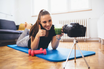 woman vlogger recording a vlog from her home about healthy living