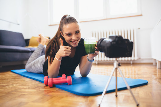 woman vlogger recording a vlog from her home about healthy living
