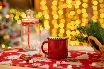 Obraz na płótnie Canvas Christmas gifts on the table tablecloth with Christmas ornament.