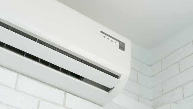 Working home air conditioning. Opening blades of the air conditioner.