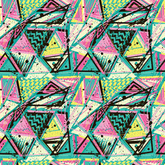 Fototapeta premium Abstract seamless pattern for girls, boys, clothes. Creative background with dots, geometric figures triangle. Funny wallpaper for textile and fabric. Fashion style. Colorful bright