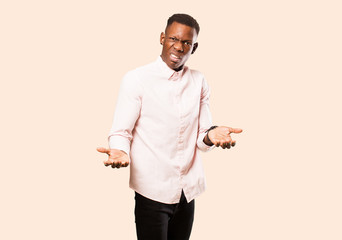 young african american black man feeling clueless and confused, not sure which choice or option to...